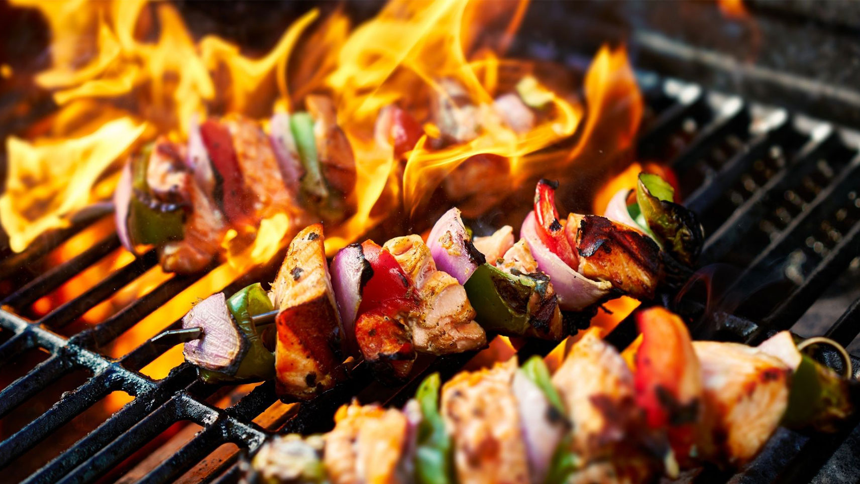 Chicken and Vegetables skewers on a charcoal grill